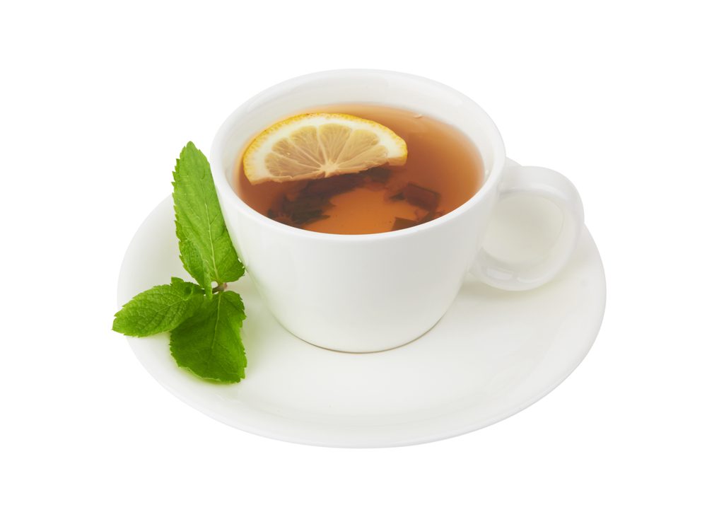 lemon tea with berries on white background