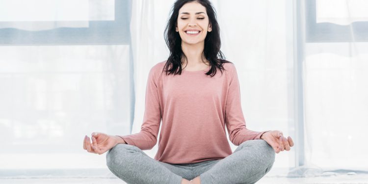 Woman meditating for anxiety relief