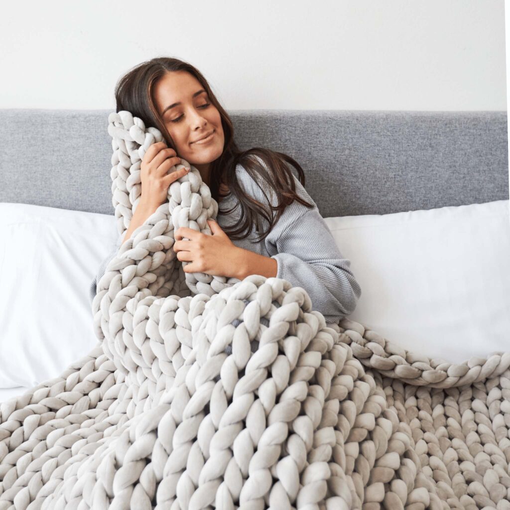 self care gifts for people with anxiety, such as weighted blankets and fidget rings