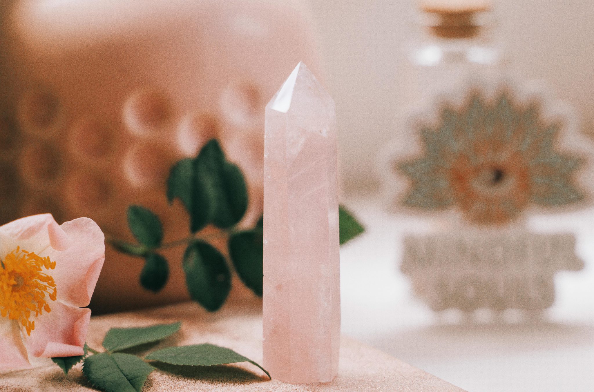 the gemstone of rose quartz, with its pink coloring and ability to attract love and heal emotional trauma