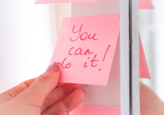 affirmations for anxiety and inspirational quotes on pink sticker on the mirror,handwriting text.