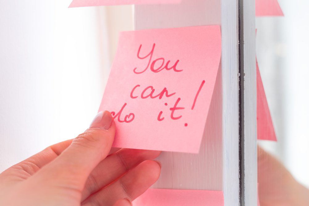 affirmations for anxiety and inspirational quotes on pink sticker on the mirror,handwriting text.
