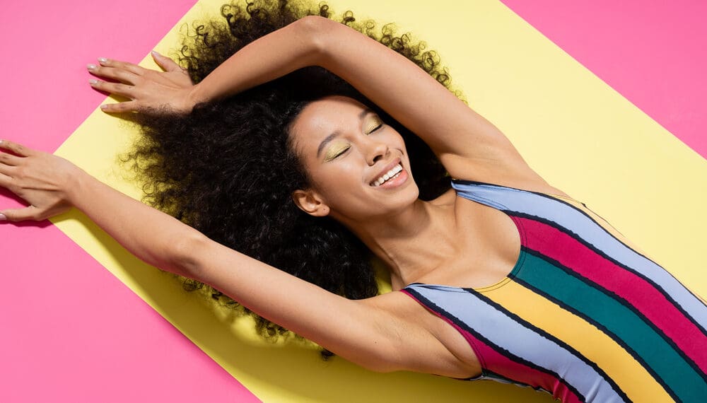 Woman practicing self care to increase serotonin naturally through meditation, sunlight, and holistic wellness practices for anxiety relief