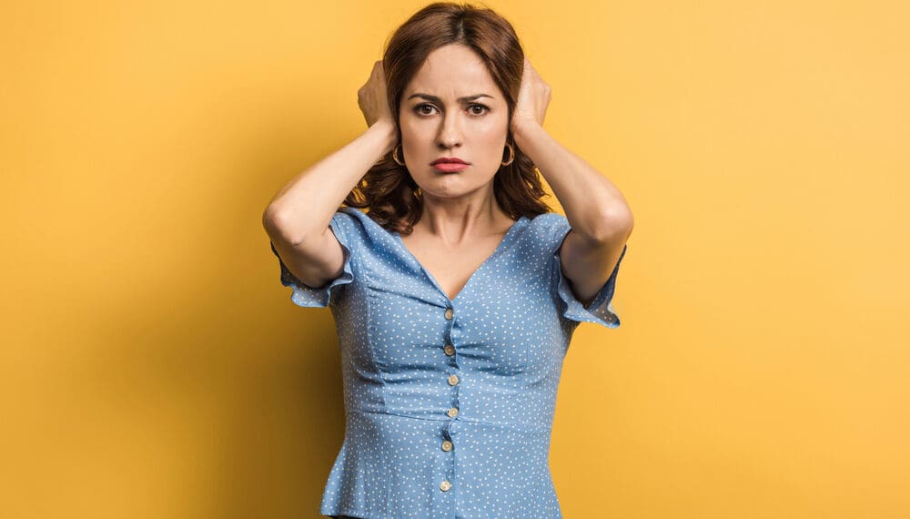 Woman practising self-love and mindfulness to overcome negative self talk and anxiety