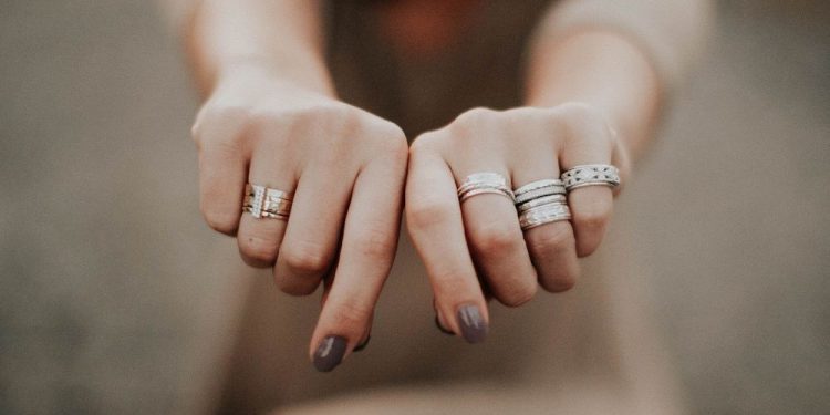 a collection of anxiety jewelry, specifically, fidget rings and mood rings