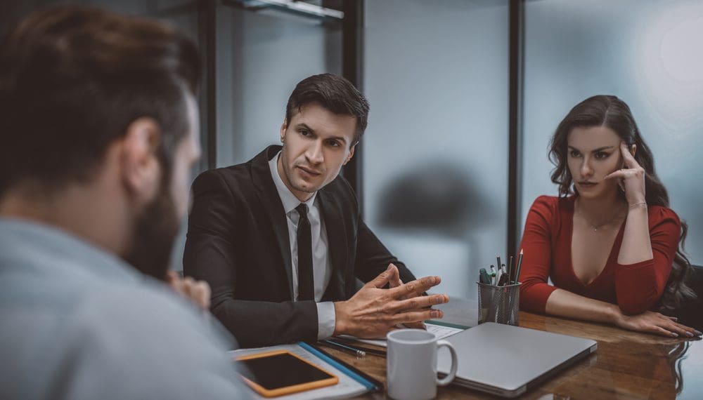 Difficult situation. A calm and confident layer resolving a dispute between spouses