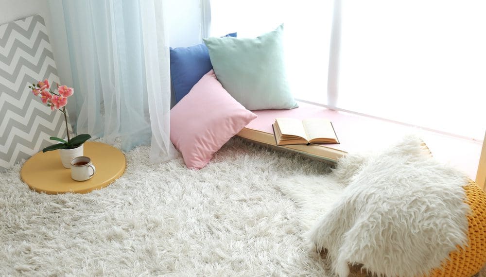 A cozy calm corner with soft lighting, fidget rings, healing crystals, and self-care items, creating a peaceful and relaxing home environment.