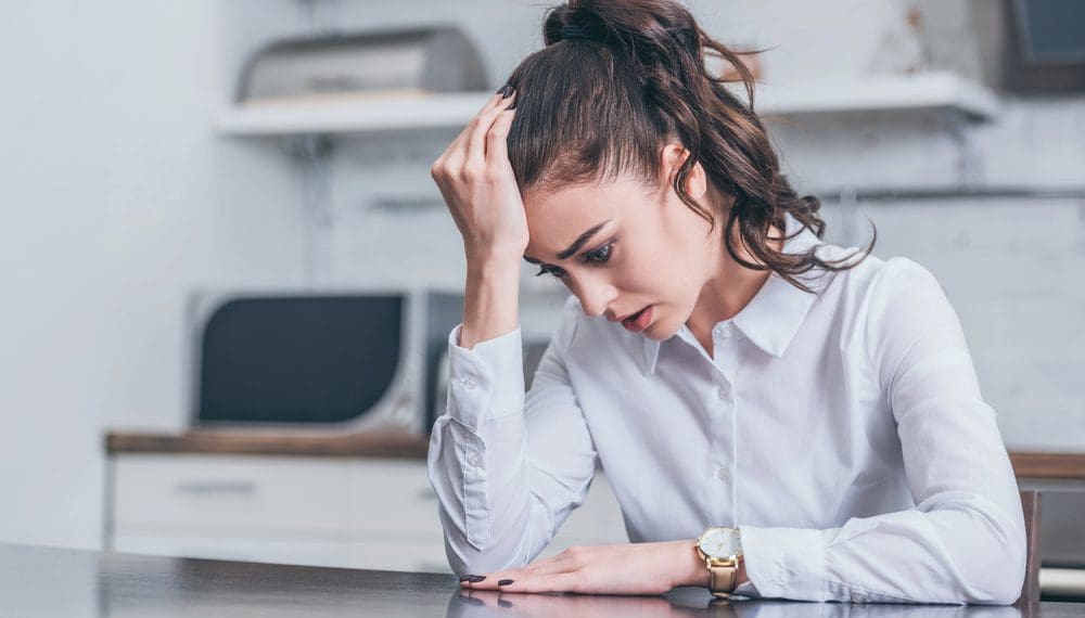 woman with generalized anxiety disorder, using her fidget ring for anxiety relief