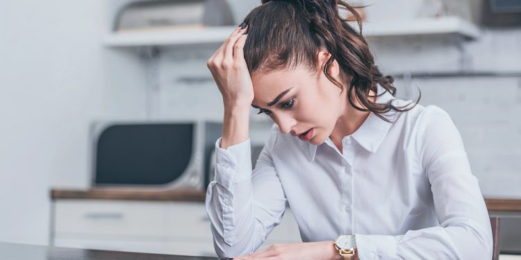 woman with generalized anxiety disorder, using her fidget ring for anxiety relief