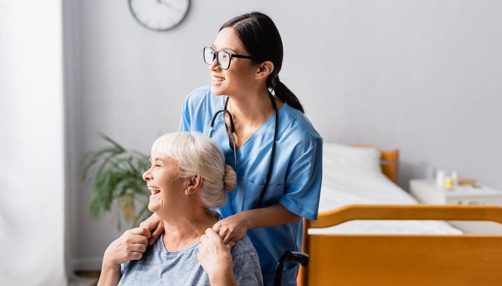 A nurse holding a patient's hand, providing reassurance and comfort through compassionate nurse-patient communication, reducing anxiety in hospitals, and promoting mental health and wellness.
