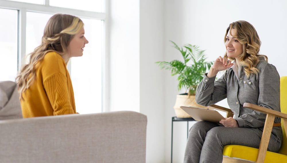 "A compassionate mental health provider consulting with a patient, offering expert care for anxiety, depression, and emotional well-being. Find the best mental health provider with the right credentials, therapy options, and holistic approaches like self-care items, crystals for anxiety, and relaxation gifts.