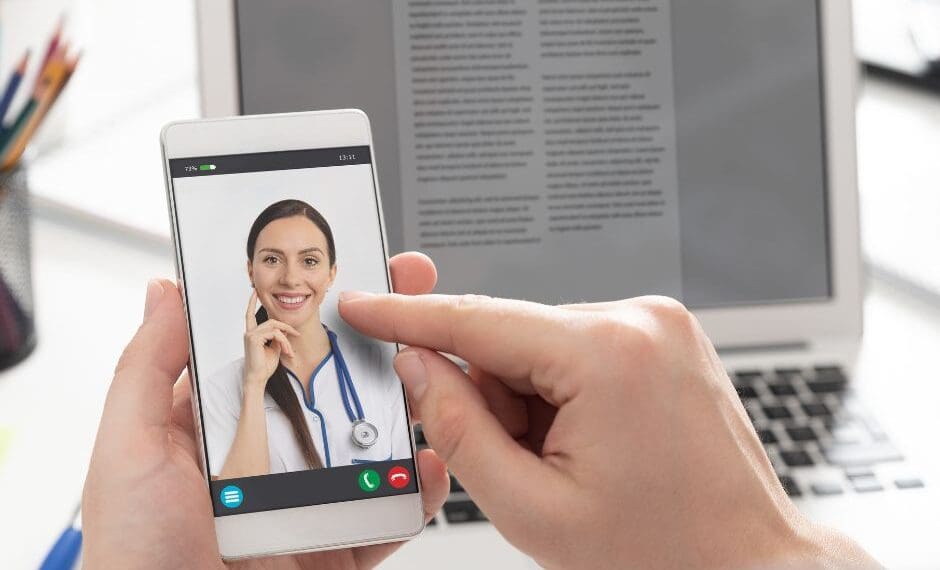 Person using a mental health app on their phone, symbolizing the support of AI-driven virtual therapists and digital wellness tools.
