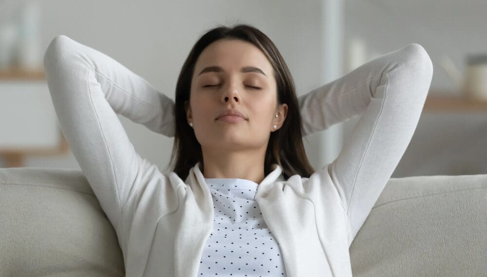 Close-up of a person gently spinning a fidget ring on their finger, illustrating a calming self care practice for anxiety and stress relief.