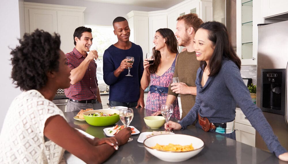 Young woman at a party confidently staying sober in a social setting, using tips from Anxiety Gone to support her mental health, sobriety, and self care journey with fidget rings, mental health gifts, and anxiety relief tools.